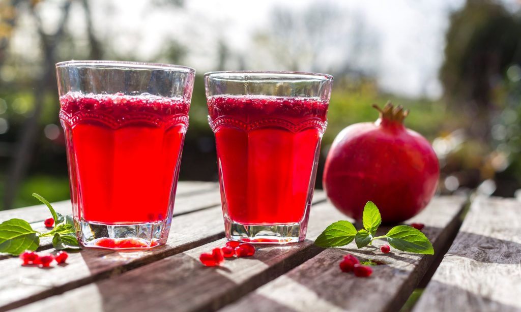 Pomegranate syrup with pomegranate seeds and prosecco. Photograph: Westend61/Getty Images