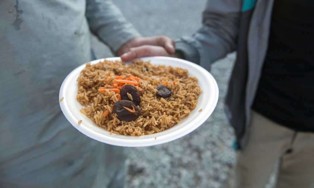 Dinner offered by an organisation in Calais. Food is harder to find since a cafe feeding children for free was shut. Photograph: Alecsandra Raluca Drăgoi for the Guardian