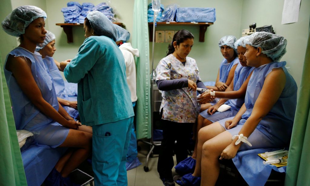 Women prepare for sterilization surgery at a hospital in Caracas. Photograph: Carlos Garcia Rawlins/Reuters