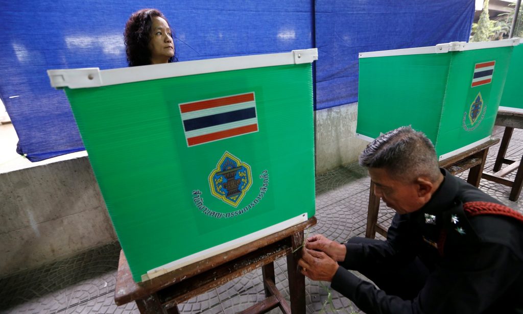 Thai electoral workers set up a polling station in Bangkok. Photograph: Jorge Silva/Reuters