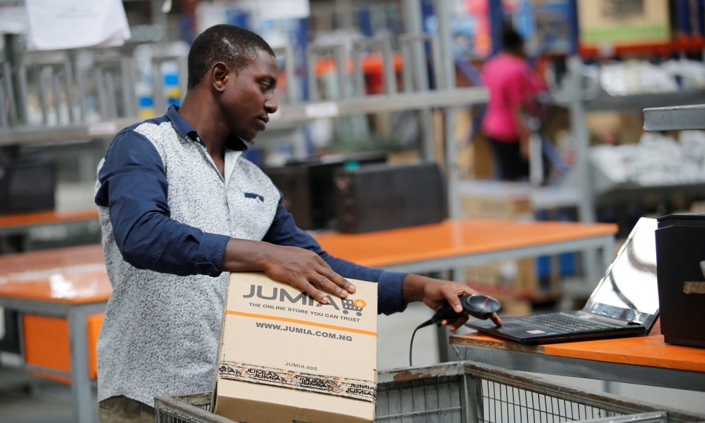 A Jumia employee at a warehouse in Lagos. The company makes thousands of deliveries a day in Nigeria alone. Photograph: Akintunde Akinleye/Reuters