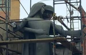 A sculpture, titled Mother of the Martyr, depicts a slender peasant woman, a traditional artistic representation of Egypt, with her arms outstretched with a helmeted soldier standing behind her, at a public square in Sohag, Egypt. Photo: African News Agency 