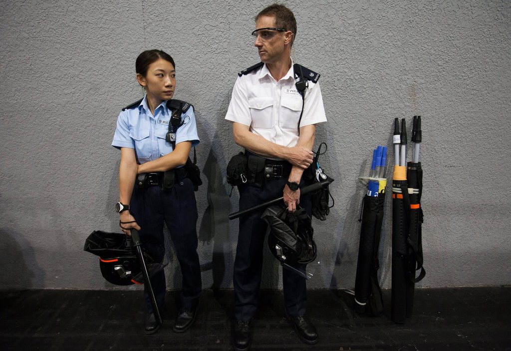 Hong Kong police officers wear riot gear ahead of the announcement of the results of Hong Kong’s Legislative Council elections on Monday. Photograph: Alex Hofford/EPA