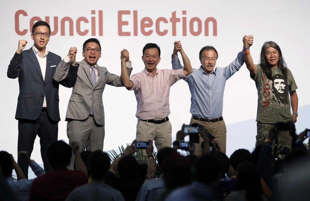 Pro-democracy candidates Lam Cheuk-ting, Alvin Yeung Ngok-kiu, Raymond Chan Chi-chuen, Fernando Cheung and Leung Kwok-hung (left to right) celebrate after winning seats. Photograph: Kin Cheung/AP