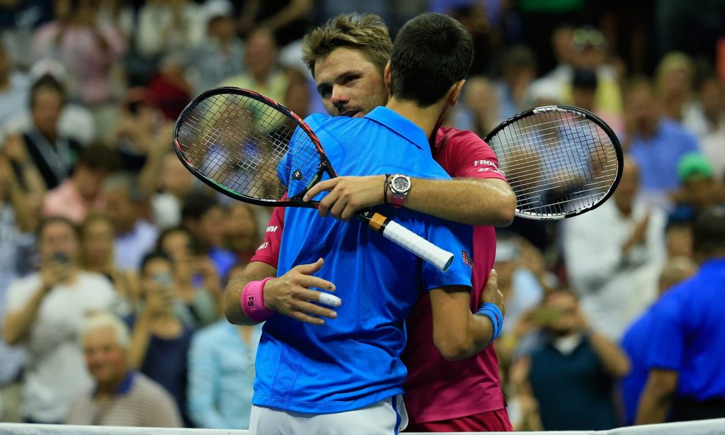 Stan Wawrinka and Novak Djokovic embrace at the end of their match at Flushing Meadows. Photograph: Chris Trotman/Getty Images for USTA