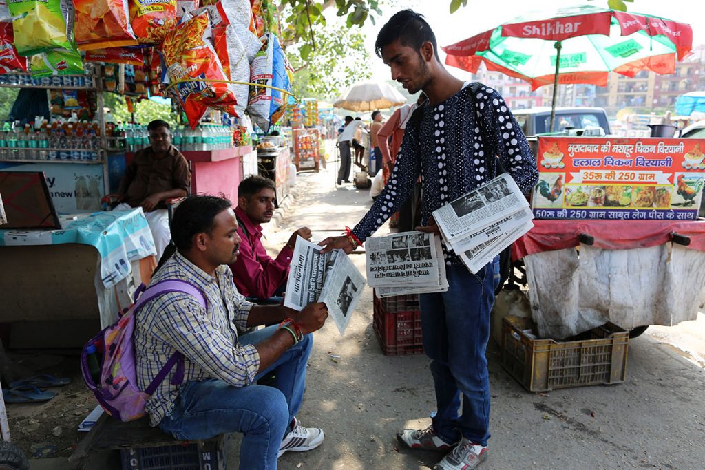 Once the newspaper is published, it is distributed free to shopkeepers, policemen and to areas where one would find street children.  (Showkat Shafi/Al Jazeera)