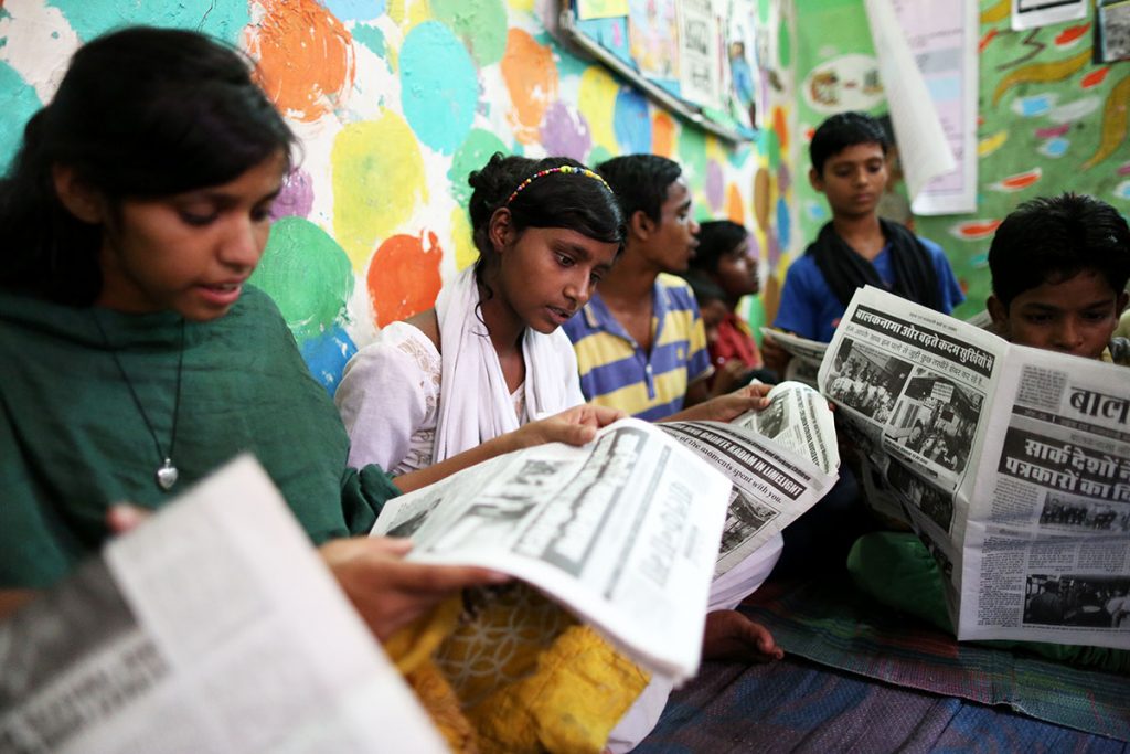Some of the children who join the newspaper's team of journalists are inspired to start attending school as well. (Showkat Shafi/Al Jazeera)