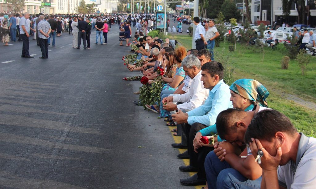 People gather to pay the tribute to Islam Karimov in Tashkent. Photograph: STRINGER/Reuters
