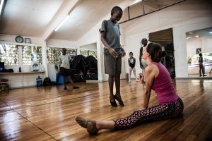 Cooper Rust is the Artist director at Dance center Kenya, she says that even though the kids train in a small, old room and without shoes, there is really not much difference from the kids who train in her studio a few times a week, here she drilling Dickens, 13 in his dance