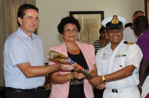 The British High Commissioner to Seychelles, Mr. Matthew Forbes, the Minister for Employment and Human Resources Development of Seychelles, Mrs. Macsuzy Mondon and representing the Indian High Commission to Seychelles Naval Advisor, Lt. Col. Shishir Dixit, are excited the Queen's Baton 2010 Delhi is in the Seychelles on January 3, 2010.