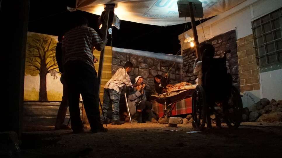 Filming often takes place at night due to the lack of electricity in the camp during the day, when the group hold rehearsals instead. © UNHCR/Houssam Hariri