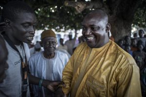 Gambian presidential candidate Adama Barrow greets supporters in Jambur on November 26. Barrow is backed by a coalition of seven opposition parties and has called on President Jammeh to accept the result of the election if he is defeated. MARCO LONGARI/AFP/GETTY