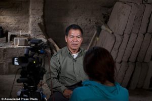 In this Dec. 11, 2015 photo, Juan Chen Chen, a survivor of the Rio Negro massacre, speaks during an interview to the Guatemalan Forensic Anthropology Foundation FAFG in Rabinal, Guatemala. I saw when they put a bullet in my fathers head, he said. My father was left lying there, and the dogs began to eat his brains. (AP Photo/Moises Castillo)