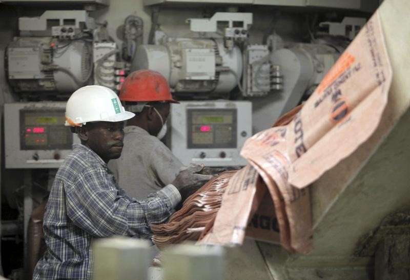 Labourers work at the Dangote Cement factory in Obajana village in Nigeria's central state of Kogi November 8, 2010. REUTERS/Akintunde Akinleye
