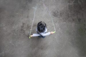 asian girl playing rope skipping