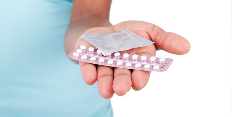 woman-holding-contraceptives