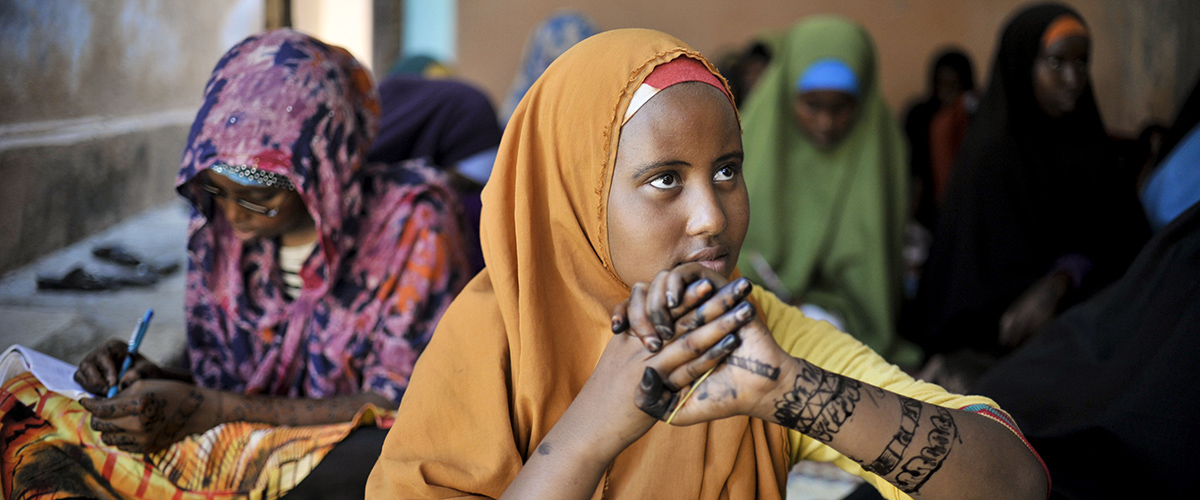 A girl at the Mother and Child Health Center in Mogadishu, Somalia, sits with other girls during a visit by the Special Representative of the Secretary-General on Sexual Violence in Conflict to the hospital on April 2. The SRSG, Zainab Bangura, visited Somalia this week on a mission to engage with various stakeholders on ways in which conflict related sexual violence can be addressed and prevented. The SRSG visited various IDP camps, hospitals, and women's shelters while in the country. AU UN IST PHOTO / TOBIN JONES.