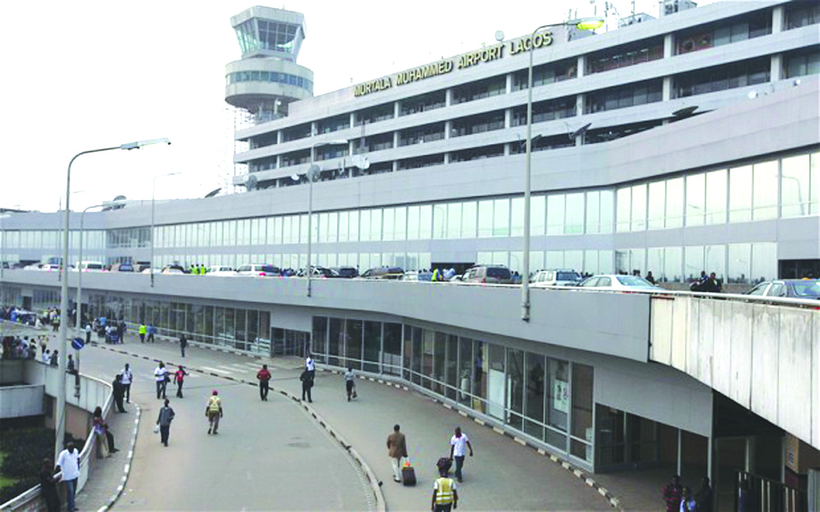 In this photo taken on Monday, Feb. 4, 2013 passengers and passerby are seen at the Murtala Muhammed International Airport  in Lagos, Nigeria.  A British national has been kidnapped near Lagos international airport, in Nigeria's commercial capital, the British Consulate-General reported Friday, July 19, 2013. Spokesman Wale Adebayo says diplomats are working with Nigerian authorities on this week's kidnapping. He said he could give no other information because of the "sensitive nature" of the issue. (AP Photo/Sunday Alamba)