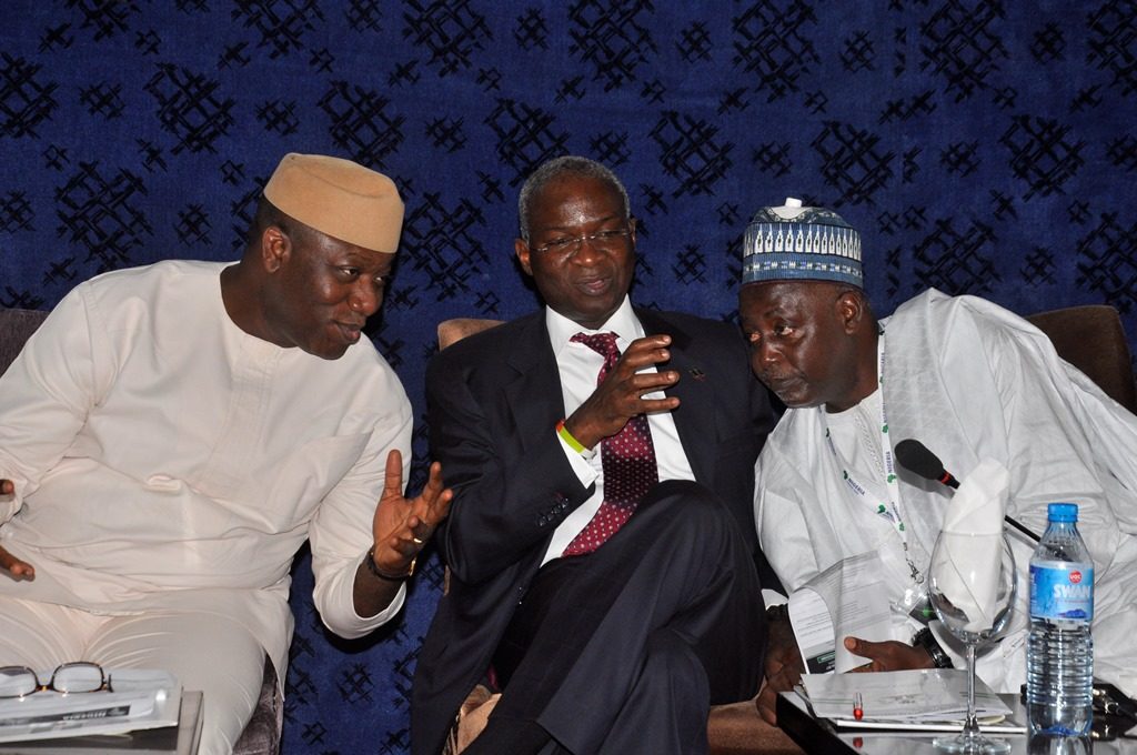 L-R: Minister of Mines and Steel Development, Dr Kayode Fayemi and Minister of Power, Works and Housing, Mr Babatunde Fashola (SAN); and President, Miners Association of Nigeria (MAN), Alhaji Shehu Sani; at the opening session of the Nigeria Mining Week, in Abuja