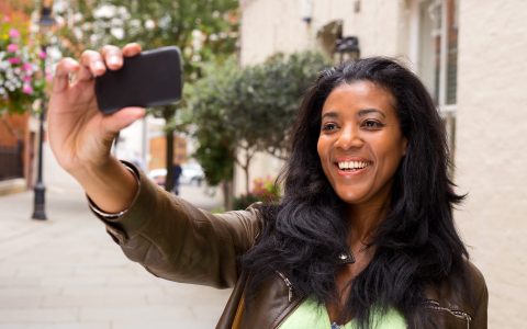 african american woman taking a selfie