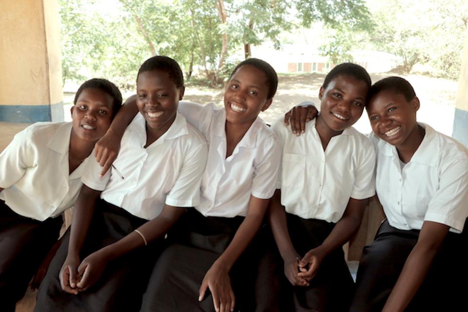 Rehema, right and friends at school all on KIND scholarships. Photo: UNICEF USA