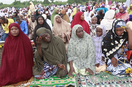 Nigeria Muslims offer Eid al-Adha prayers in Lagos, Nigeria, Saturday, Oct. 4, 2014. Muslims around the world will celebrate Eid al-Adha, the Festival of Sacrifice, to mark the end of the hajj pilgrimage by slaughtering sheep, goats, cows and camels to commemorate Prophet Abraham's readiness to sacrifice his son Ismail on God's command. (AP Photo/Sunday Alamba)