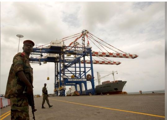 A Djibouti policeman stands guard during the opening ceremony of Dubai-based port operator DP World's Doraleh container terminal in Djibouti port February 7, 2009. REUTERS/Ahmed Jadallah/File Photo