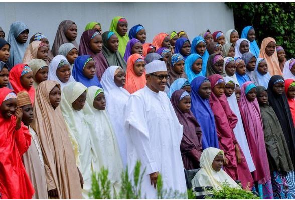 Nigeria's President Muhammadu Buhari meets with some of the newly released Dapchi schoolgirls in Abuja, Nigeria March 23, 2018. Nigeria Presidency/Handout via Reuters
