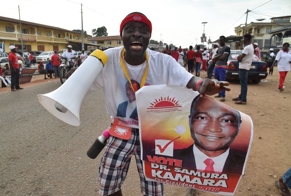 A supporter of Sierra Leone's All People's Congress presidential candidate Samura Kamara cheers during a campaign rally on March 5. Photographer: Issouf Sanogo/AFP via Getty Images