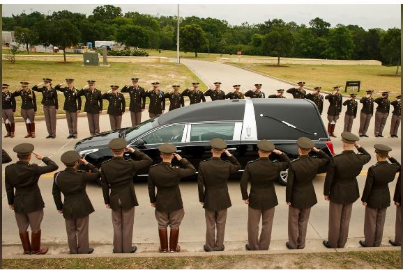 The hearse carrying former first lady Barbara Bush passes through members of the Texas A&M Corps of Cadets as it nears her husband's presidential library at the university in College Station, Texas, U.S. April 21, 2018. Smiley N. Pool/Pool via REUTERS