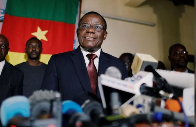 Maurice Kamto of Renaissance Movement (MRC) smiles as he holds a news conference at his headquarter in Yaounde, Cameroon October 8, 2018. REUTERS/Zohra Bensemra