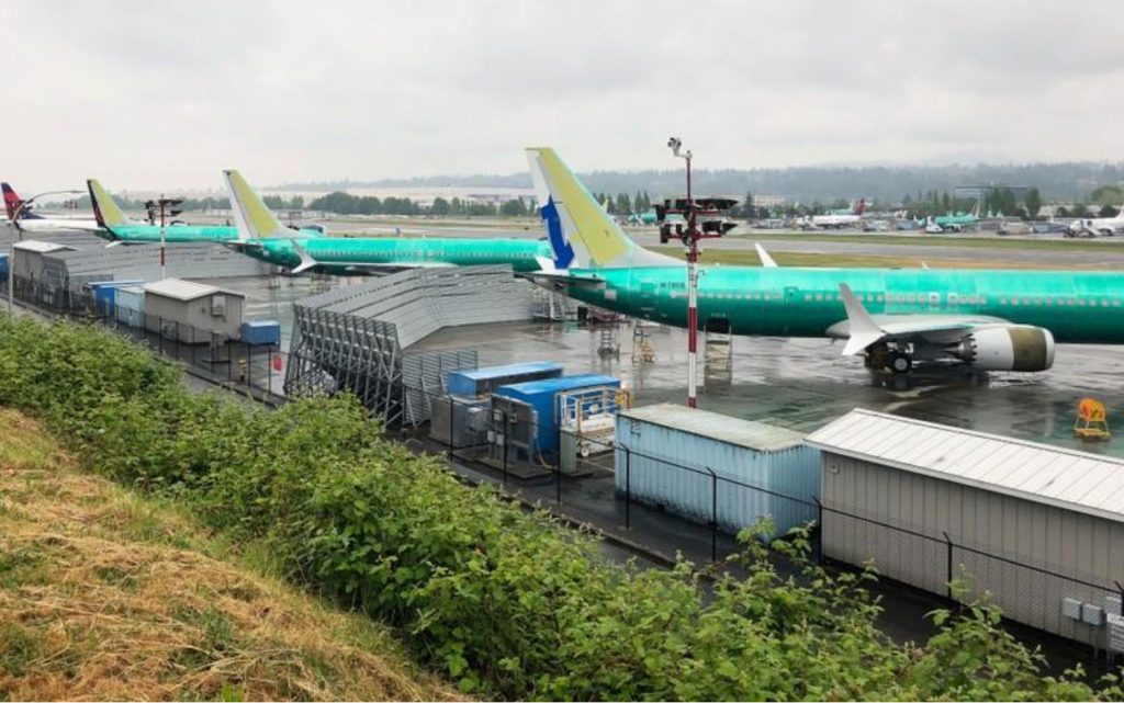 A row of three green 737 MAX jetliners sit parked on the tarmac at Renton Municipal Airport in Renton, Washington, U.S. May 16, 2019. REUTERS/Eric Johnson