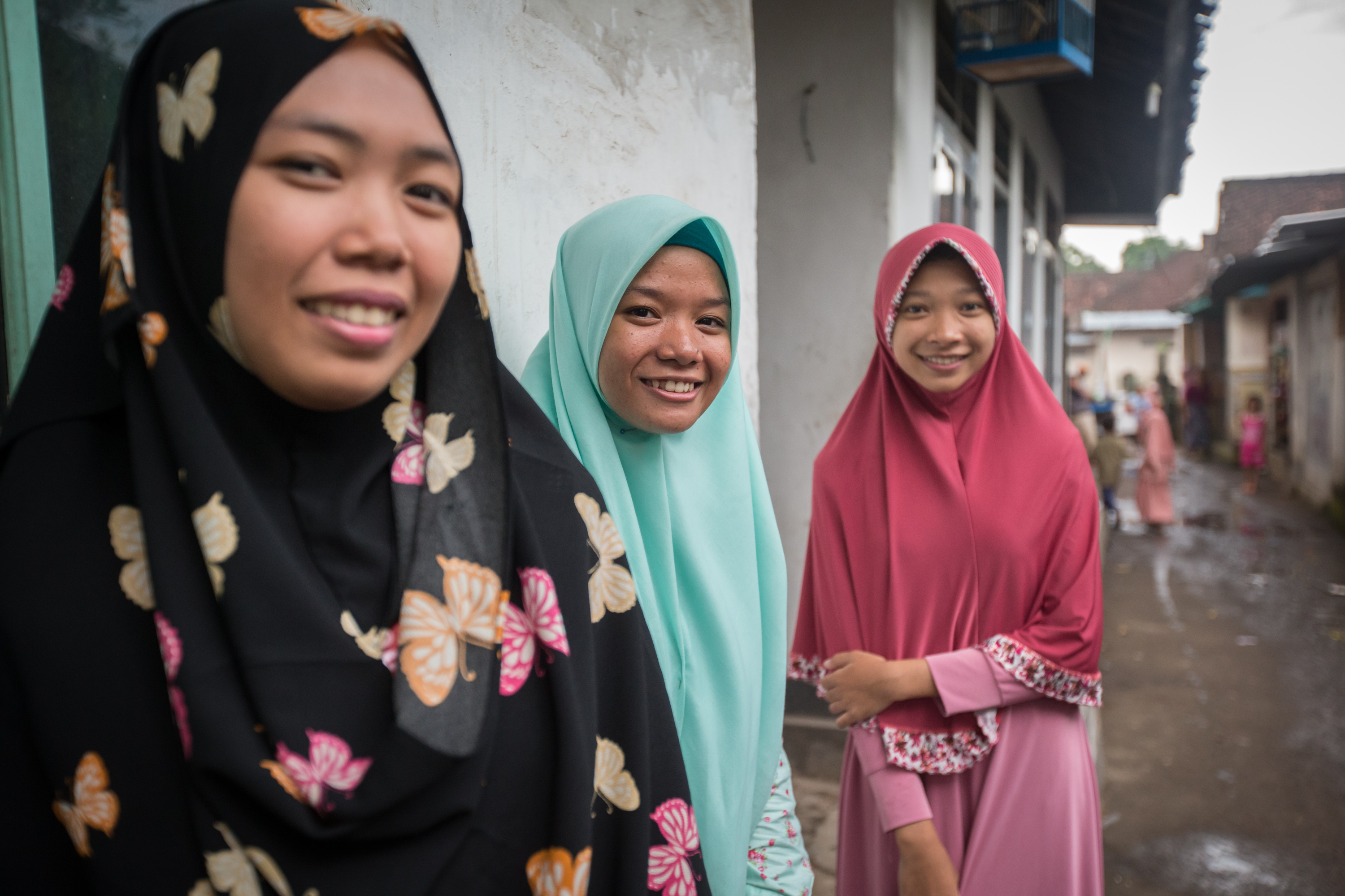 5 March, 2018, Kediri Village, Lombok  Indonesia: Local girls from left, Holida,18, Suci,18 and Ria,16, walking the streets of the K.R Bedil Utara village after talking with Girls Not Brides Mabel van Orange about child marriage and sexual health issues. The girls were inspired to join the local child protection units to spread the message about the dangers of child marriage often walking the streets of the villages with a megaphone and placards. Picture by Graham Crouch/Girls Not Brides