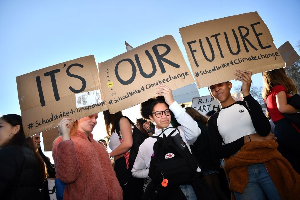 Young demonstrators hold placards as they attend a climate change protest organised by "Youth Strike 4 Climate", opposite the Houses of Parliament in central London on February 15, 2019. - Hundreds of young people took to the streets to demonstrate Friday, with some of them having gone on strike from school, as part of a global youth action over climate change. (Photo by Ben STANSALL / AFP) (Photo credit should read BEN STANSALL/AFP/Getty Images)