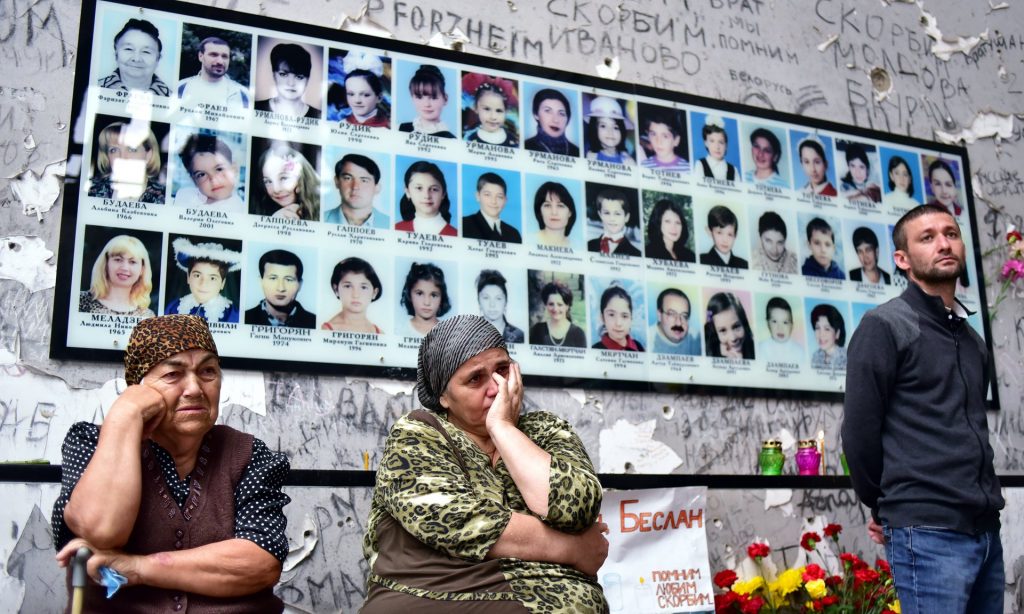 People gather in the gym at School Number One to commemorate the victims of the Beslan school siege that killed 334. Photograph: Anton Podgaiko/Tass
