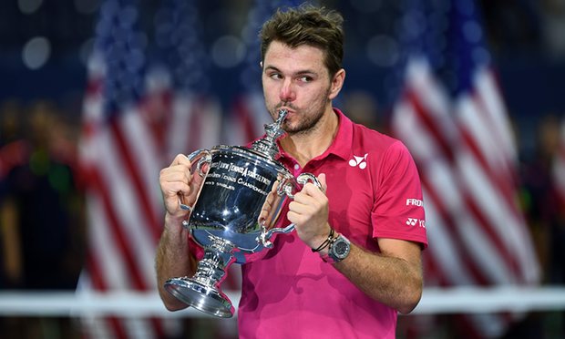 Stan Wawrinka kisses the trophy after defeating Novak Djokovic in four sets in the US Open men’s tennis final. Photograph: Jewel Samad/AFP/Getty Images