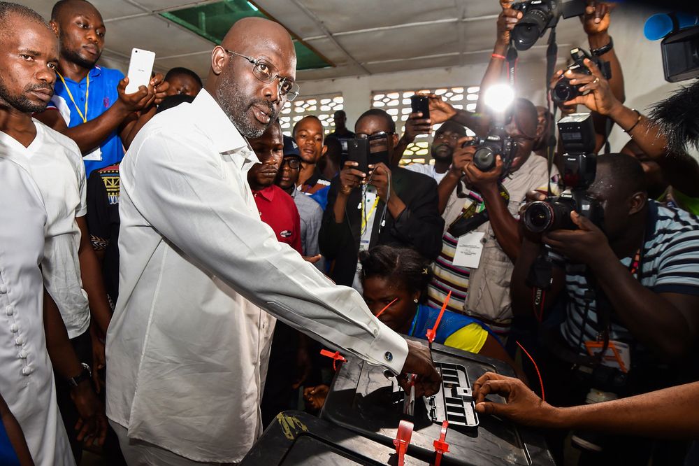 George Weah casts his vote for Liberia's elections, at a polling station in Monrovia on Oct. 10, 2017. Photographer: Issouf Sanogo/AFP via Getty Images