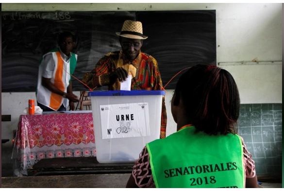 A man casts his ballot during Ivory Coast's first ever election of senate members in Abidjan, Ivory Coast March 24, 2018. REUTERS/Luc Gnago
