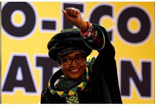 Winnie Madikizela Mandela, ex-wife of former South African president Nelson Mandela, gestures to supporters at the 54th National Conference of the ruling African National Congress (ANC) at the Nasrec Expo Centre in Johannesburg, South Africa December 16, 2017. REUTERS/Siphiwe Sibeko
