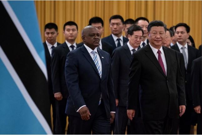 China's President Xi Jinping (R) and President of Botswana Mokgweetsi Masisi arrive for the welcome ceremony at the Great Hall of the People in Beijing, China, 31 August 2018 Roman Pilipey/Reuters