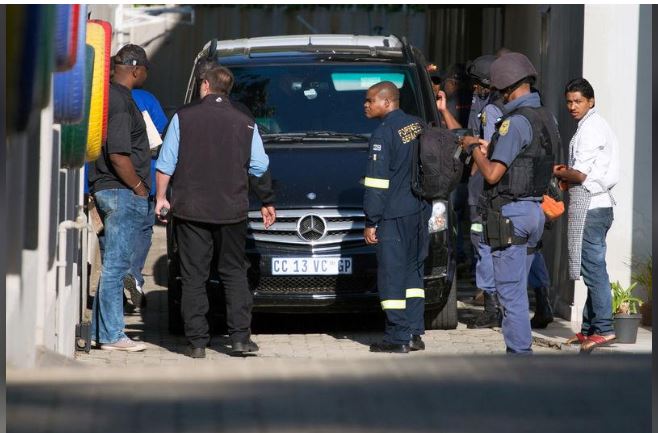 Police raid the home of the Gupta family, friends of President Jacob Zuma, in Johannesburg, South Africa, February 14, 2018. REUTERS/James Oatway