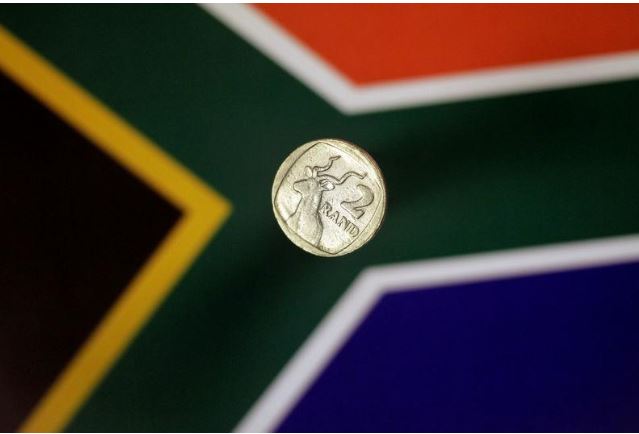 Illustration photo shows a two-rand coin above a South African flag April 12, 2017. REUTERS/Thomas White/Illustration