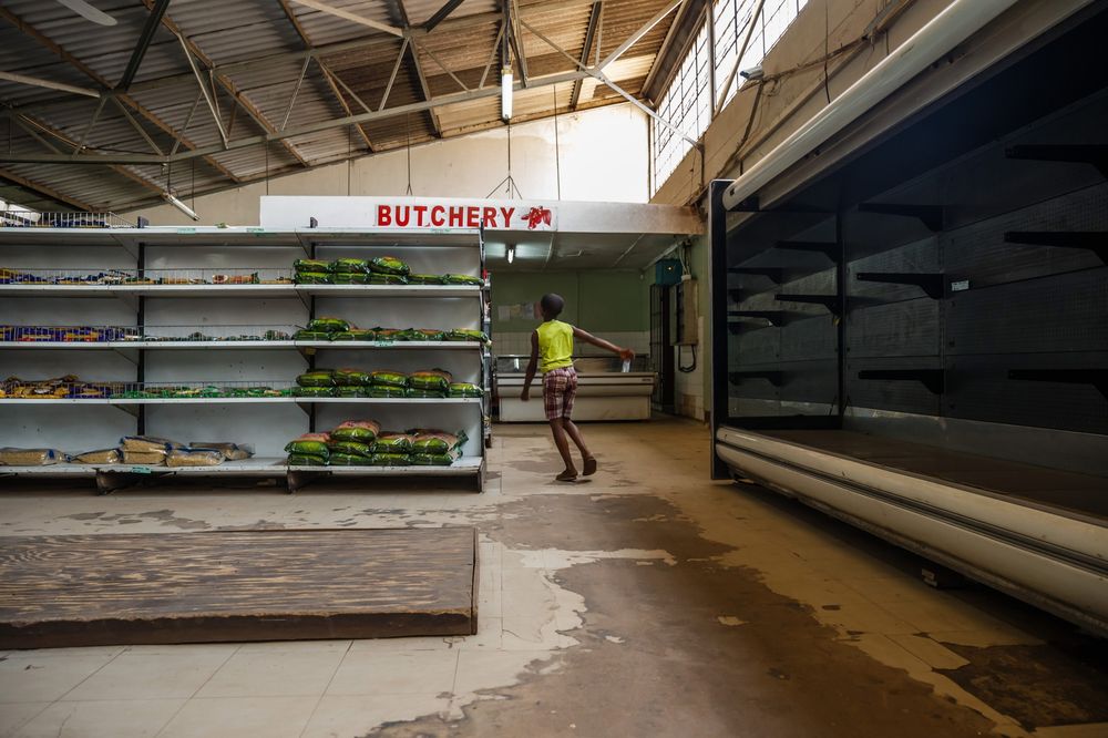 Empty shelves in a grocery store in Harare. Photographer: Jekesai Njikizana/AFP via Getty Images