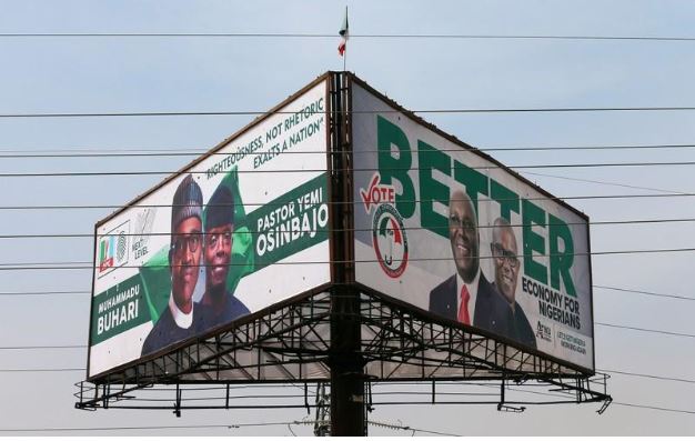 Election campaign billboards depicting Nigeria's President Muhammadu Buhari with his Vice President, Yemi Osinbajo, and Nigeria's main opposition party presidential candidate Atiku Abubakar with his running mate, Peter Obi, are pictured in Abuja, Nigeria February 5, 2019. REUTERS/Afolabi Sotunde